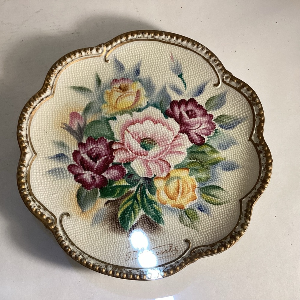 Porcelain bisque floral needlepoint plate